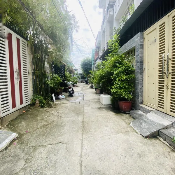 Nhà 4 tầng hẻm xe hơi 803 Huỳnh Tấn Phát 4m x 16m